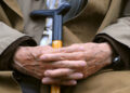 Pensioner with cane