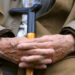 Pensioner with cane