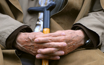 Pensioner with cane