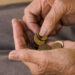 Pensioner counting coins