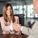 A smiling middle-aged new employee is successfully onboarded by a corporate human resources executive