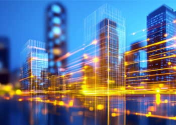 Digital cityscape with illuminated buildings and flowing light trails, representing structured infrastructure and scalable systems supporting growth.
